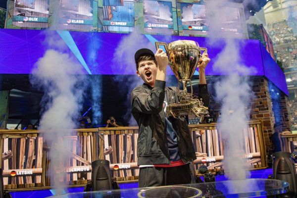 Bugha lifting the trophy after winning $3M. (Image via Epic Games)